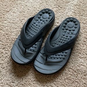 Mens black crocs with gray footbed.
